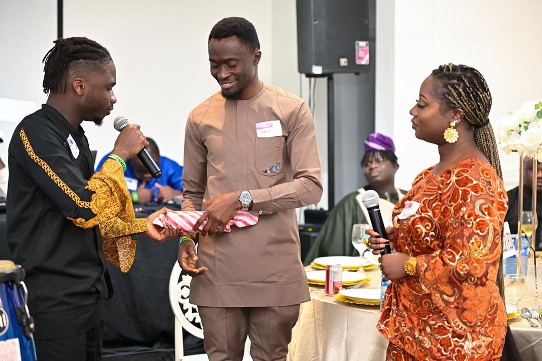 Host presenting a gift to a guest during a games segment